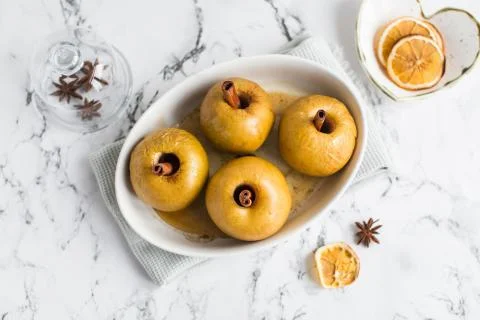 Baked apple with cinnamon stick Stock Photos