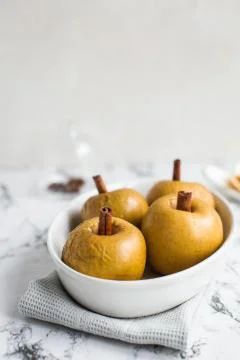 Baked apple with cinnamon stick Stock Photos