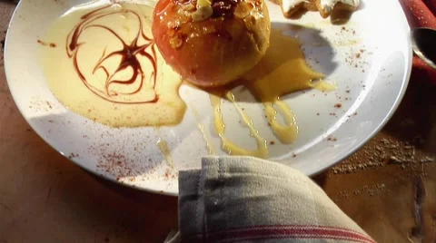 Baked apple with custard and cinnamon stars Stock-Footage 8570571