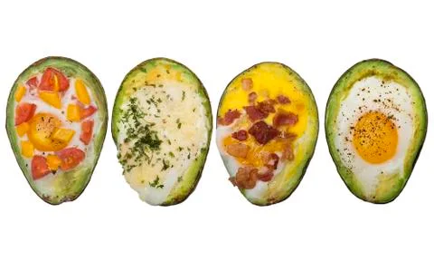 Baked avocado with eggs on white background Stock Photos