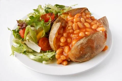 Baked bean jacket potato with side salad Stock Photos