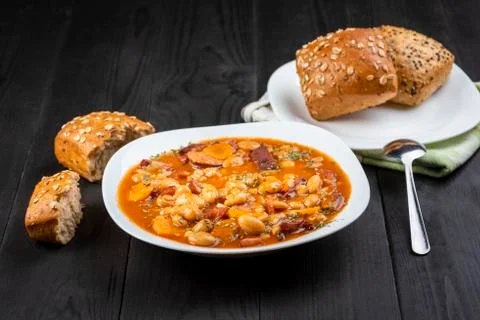 Baked beans with sausage and vegetables Stock Photos