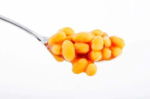 Baked beans in spoon Stock Photos