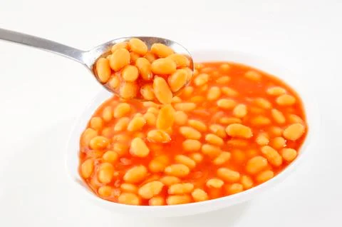 Baked beans in  spoon Stock Photos
