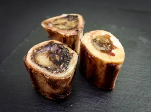 Baked beef brain bones on a dark background Stock-Fotos