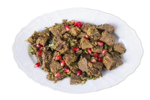 Baked beef liver with walnuts. Stock Photos