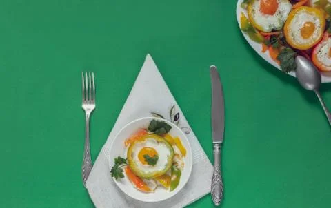Baked bell pepper with egg inside the pepper Stock Photos