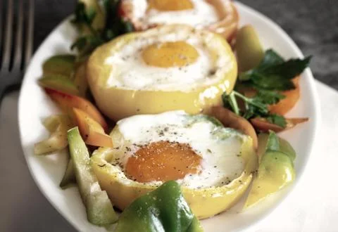 Baked bell pepper with egg inside the pepper Stock Photos