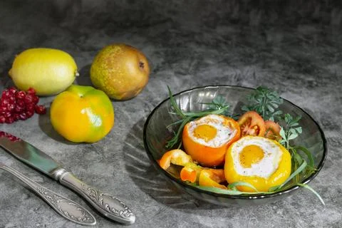 Baked bell pepper with egg inside the pepper Stock Photos