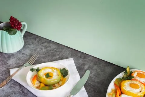 Baked bell pepper with egg inside the pepper Stock Photos