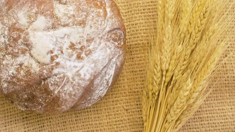 Baked bread and wheat ears Stock Footage 137052919