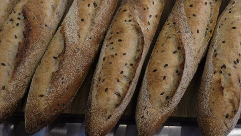 Baked bread baguettes as a background Stock Footage 113353085