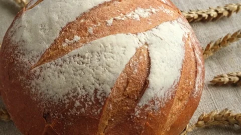 Baked bread. Loaf of Bread. Fresh Bakery Products. Stock Footage 211390490
