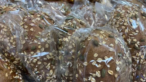 Baked bread. Loaf of Bread. Fresh Bakery Products. Healthy Food Concept. Front Stock Footage 312235644