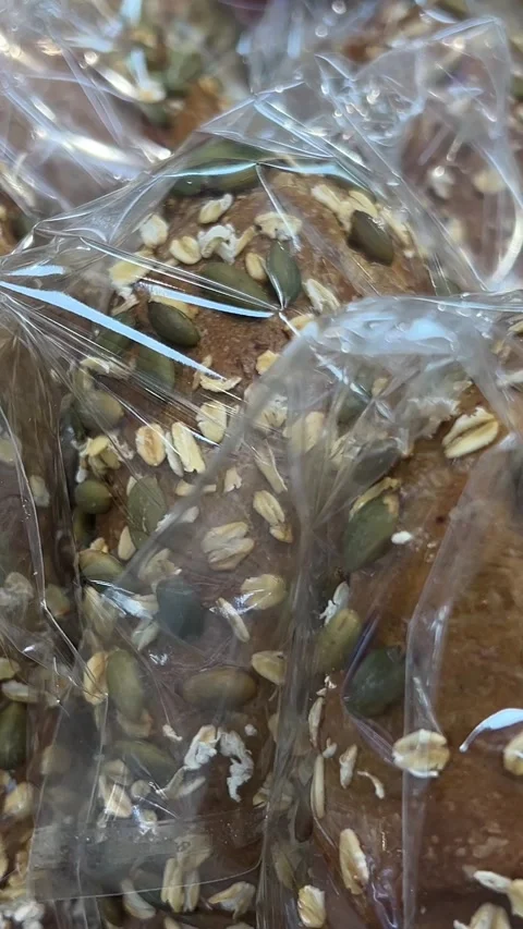 Baked bread. Loaf of Bread. Fresh Bakery Products. Healthy Food Concept. Front Stock Footage 313741177