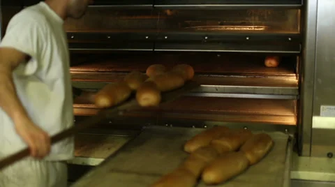 Baked bread out of the oven in a bakery 5 Stock Footage 34074471