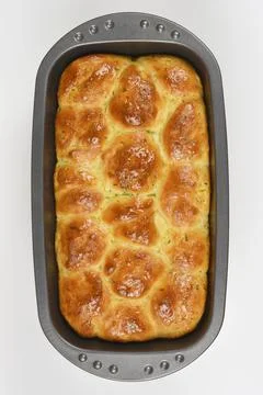 Baked bread rolls with chives in baking pan 스톡 사진