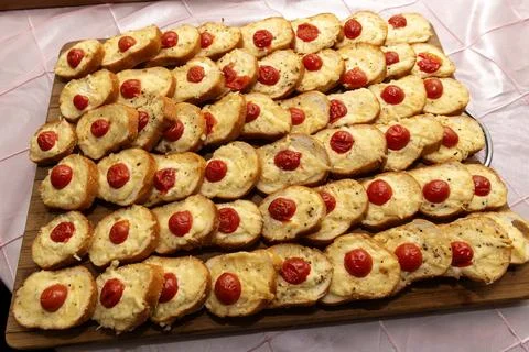 Baked Bread Slices Topped With Cherry Tomatoes Ready for Serving Stock Photos
