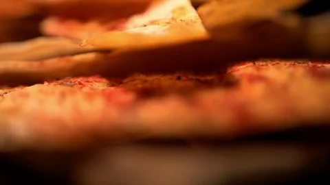 Baked bread snacks with spices and tomatoes on wooden cutting board, close-up Stock-Footage 83425688