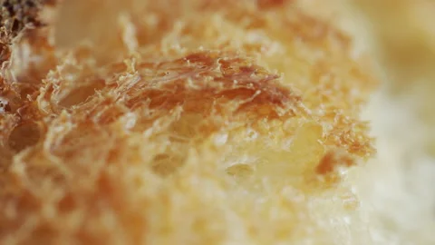 Baked bread surface shallow DOF 4K tilting video Stock Footage 169654148