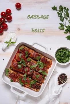 Baked cabbage rolls in square baking pan flat lay Stock Photos