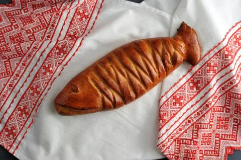 Baked a cake in the form of fish on the table-cloth Stock Photos