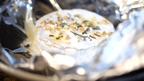 Baked Camembert, being dipped with bread in slow motion. Stock-Footage 109533504