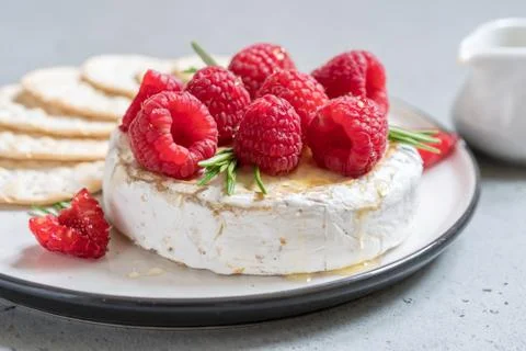 Baked Camembert cheese with raspberry Stock Photos