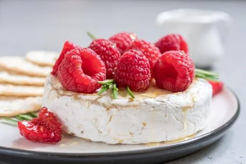 Baked Camembert cheese with raspberry Stock Photos