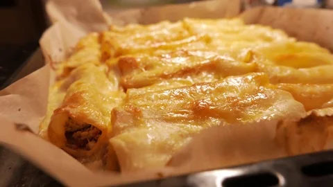 Baked cannelloni stuffed with vegetable mix. 4K UHD Stock Footage 70434583