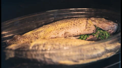 Baked carp with herbs in the oven. time-lapse Stock Footage 150720049