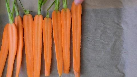 Baked carrots. Preparing carrots for baking Stock Footage 262569402