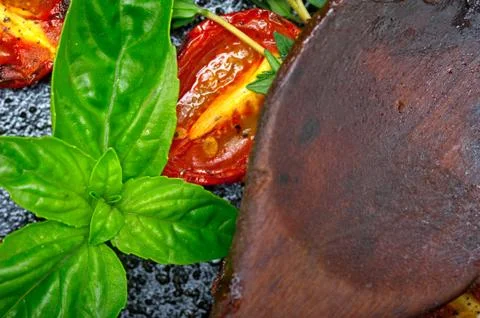 Baked cherry tomatoes with basil and thyme Stock Photos