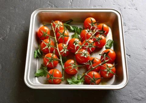 Baked cherry tomatoes Stock Photos