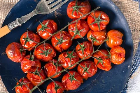 Baked cherry tomatoes Stock Photos