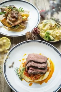 Baked chicken and beef with lemon and rosemary Stock Photos