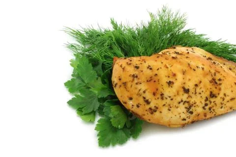 Baked chicken with greenery Stock Photos