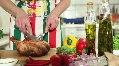 Baked chicken on the kitchen table cut into pieces 2 Stock Footage 46575776