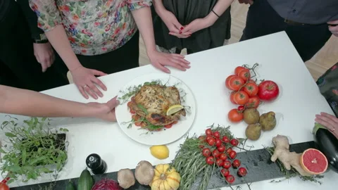 Baked chicken in the oven. Culinary students lean in to smell the fried chicken. Stock Footage 229844776
