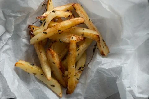 Baked Chips on Paper with Copy Space Stock Photos