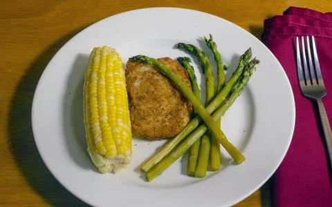 Baked cod  with  asparagus and corn Stock Photos