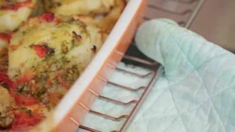 Baked cod fish in the oven. Cooking fish with peppers and herbs in the oven Stock Footage 245274995