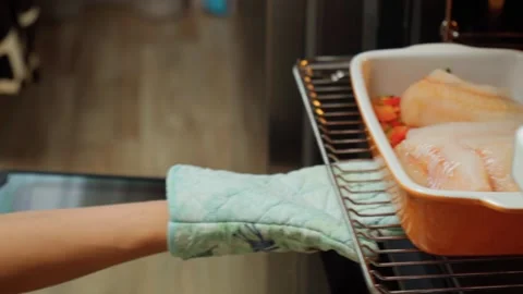 Baked cod fish in the oven. Cooking fish with peppers and herbs in the oven Stock Footage 245998143