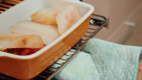 Baked cod fish served in bowl. Cooking fish in the oven. Selective focus. Stock Footage 245601839
