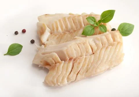 Baked cod loin with basil Stock Photos