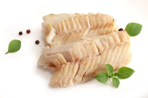 Baked cod loin with basil Stock Photos