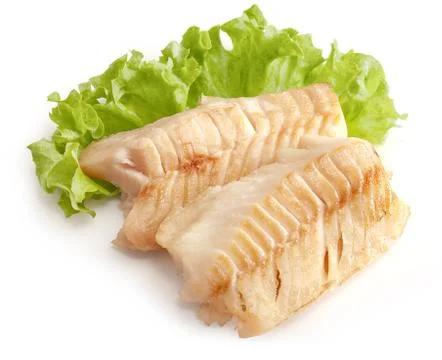 Baked cod loin with lettuce Stock Photos