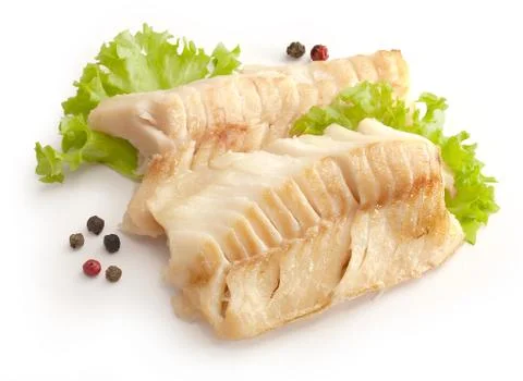 Baked cod loin with lettuce Stock Photos