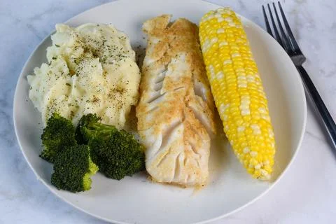 Baked cod  with  orn, broccoli and mashed potatoes, Stock Photos