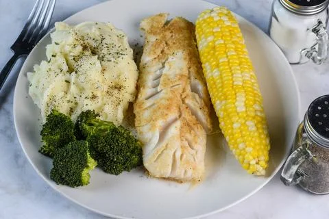 Baked cod  with  orn, broccoli and mashed potatoes, Stock Photos